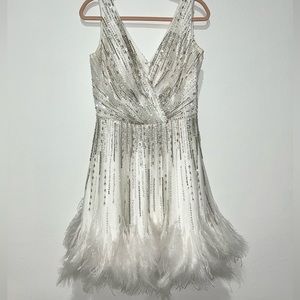 White, feathered dress by Andrea and Leo Couture.  Only worn once.